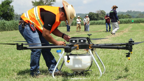 Drones loaded with pesticides.png